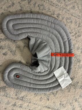 Sharper Image Grey Neck Pillow with Orange Brand Tag